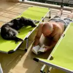 Happy adolescent dog and owner enjoying life together after finding the right balance of exercise